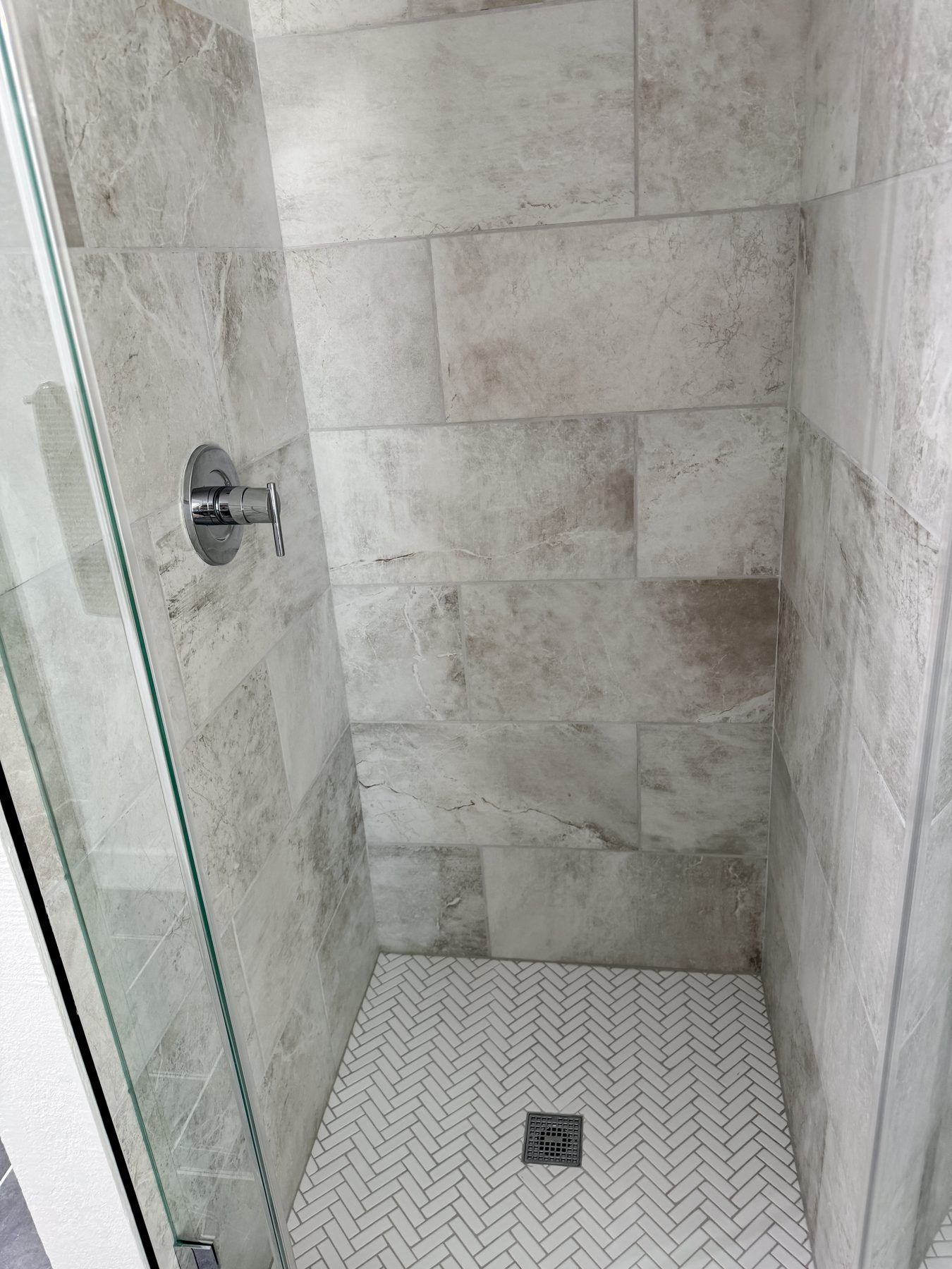 Close view of the Martinez shower tile and floor mosaic