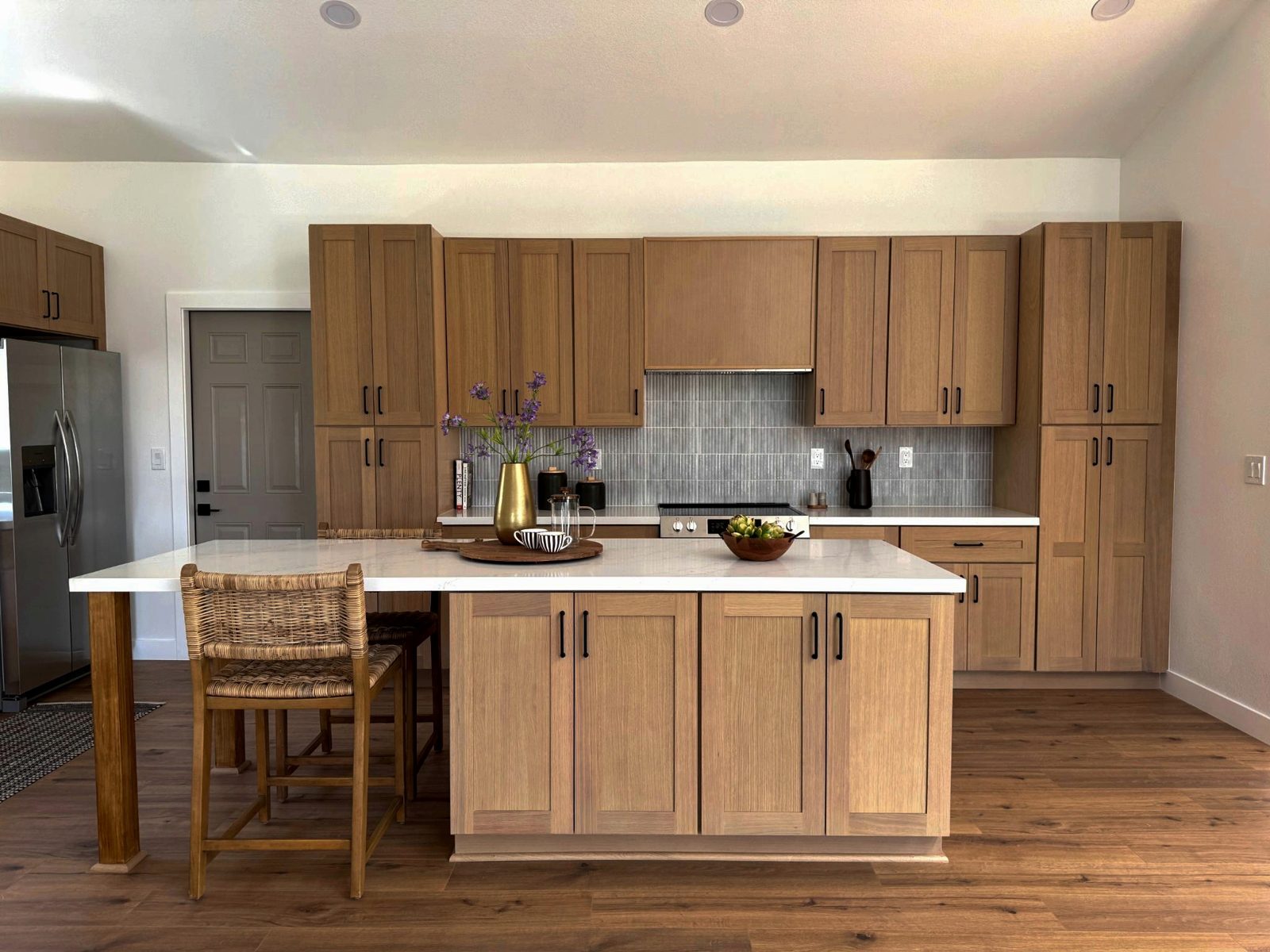 Martinez kitchen with warm wood cabinetry and island